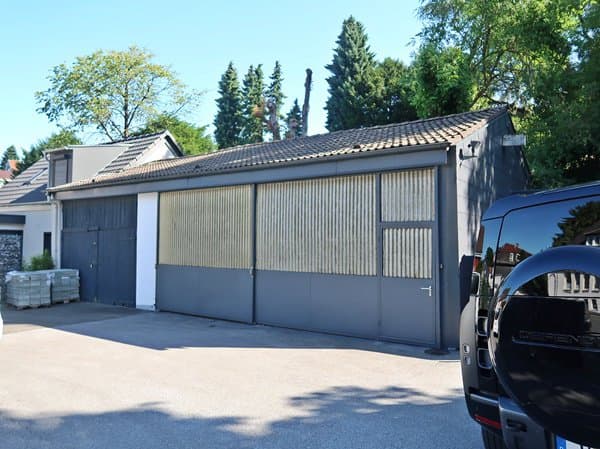 Wohnhaus, Einfamilienhaus mit Lagergebäude, 6 Garagen - Bild 1